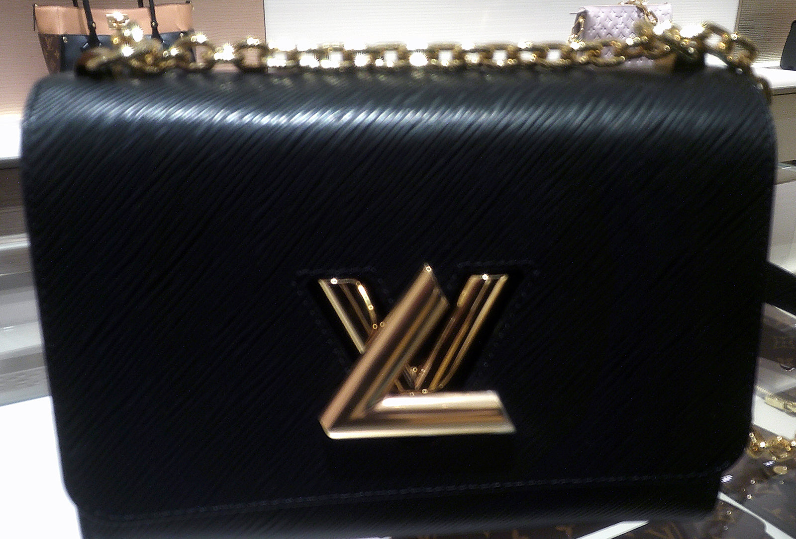 louis vuitton black bag with gold logo